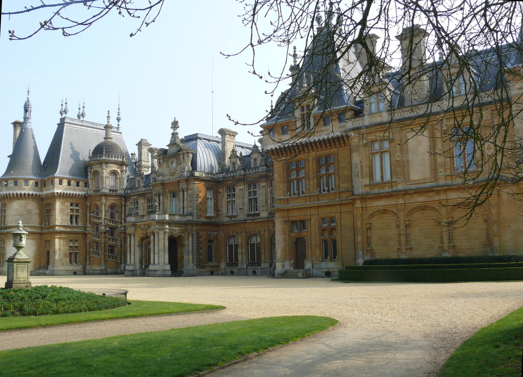 The north façade of Waddesdon Manor, a French Renaissance-style Bath-stone château with pale walls and grey slate roofs.